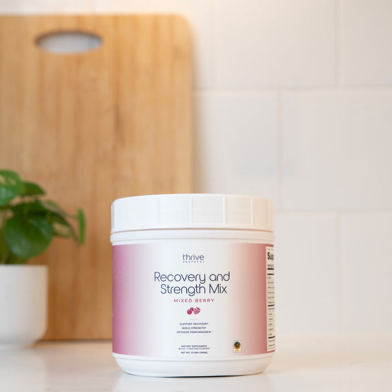 Thrive Protocol Recovery and Strength Mix Mixed Berry supplement powder container.