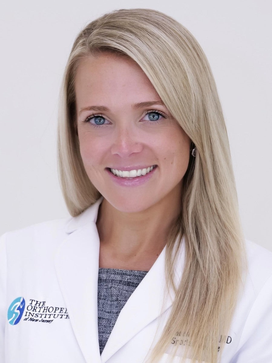 Dr. Ashley Bassett, orthopedic surgeon and co-host of The Sports Docs Podcast